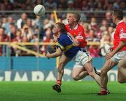 14 July 2002; Paul Cahill of Tipperary in action against Anthony Lynch of Cork during the Bank of Ireland Munster Senior Football Championship Final match between Cork and Tipperary at Semple Stadium in Thurles, Tipperary. Photo by Pat Murphy/Sportsfile
