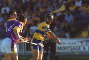 14 July 2002; Tony Carmody of Clare, is tackled by Darragh Ryan, left, and Rory Mallon of Wexford during the All-Ireland Senior Hurling Championship Qualifying Round 2 match between Clare and Wexford at O'Moore Park in Portlaoise, Laois. Photo by David Maher/Sportsfile