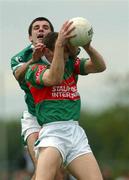 13 July 2002; David Brady of Mayo in action against Pat Ahern of Limerick during the Bank of Ireland All-Ireland Senior Football Championship Qualifier Round 3 match between Mayo and Limerick at Dr Hyde Park in Roscommon. Photo by Damien Eagers/Sportsfile