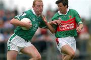 13 July 2002; John Quane of Limerick in action against Aidan Higgins of Mayo during the Bank of Ireland All-Ireland Senior Football Championship Qualifier Round 3 match between Mayo and Limerick at Dr Hyde Park in Roscommon. Photo by Damien Eagers/Sportsfile