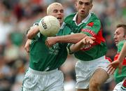 13 July 2002; Stephen Lavin of Limerick in action against Alan Roche of Mayo during the Bank of Ireland All-Ireland Senior Football Championship Qualifier Round 3 match between Mayo and Limerick at Dr Hyde Park in Roscommon. Photo by Damien Eagers/Sportsfile