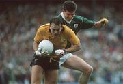 19 August 1990; Anthony Molloy of Donegal is tackled by Liam Hayes of Meath during the All-Ireland Senior Football Championship Semi-Final match between Meath and Donegal at Croke Park in Dublin. Photo by Ray McManus/Sportsfile