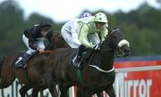 20 July 2002; Queens Warf, with Mick Kinane up, on their way to winning The Challenge Stakes, from Slaney Sand, hidden, with Kevin Manning up, and Bowmore, left, with Johnny Murtagh up, at Leopardstown Racecourse in Dublin. Photo by Aoife Rice/Sportsfile