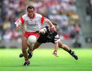 21 July 2002; Brian Dooher of Tyrone in action against Neil Carew of Sligo during the All-Ireland Senior Football Championship Qualifier Round 4 match between Sligo and Tyrone at Croke Park in Dublin. Photo by Ray McManus/Sportsfile
