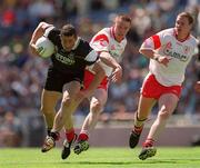 21 July 2002; Eamonn O'Hara of Sligo in action against Cormac McGinley and Cormac McAnallen, right, of Tyrone during the All-Ireland Senior Football Championship Qualifier Round 4 match between Sligo and Tyrone at Croke Park in Dublin. Photo by Ray McManus/Sportsfile