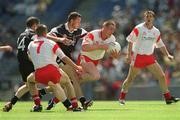 21 July 2002; Cormac McGinley of Tyrone, supported by team-mate Philip Jordan, 7, in action against Eamonn O'Hara and John McPartland, 14, of Sligo during the All-Ireland Senior Football Championship Qualifier Round 4 match between Sligo and Tyrone at Croke Park in Dublin. Photo by Ray McManus/Sportsfile