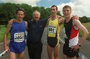 21 July 2002; Irish Runner magazine editor Frank Greally with the first three home in the adidas Irish Runner Challenge Winner Noel Berkeley, 1051, Gerry Ryan and Thomas Carey after the Adidas Irish Runner Challenge in Phoenix Park in Dublin. Photo by Ray McManus/Sportsfile