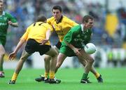 21 July 2002; Richie Kealy of Meath in action against Eamon Doherty, 17, and Christy Toye of Donegal during the All-Ireland Senior Football Championship Qualifier Round 4 match between Meath and Donegal at Croke Park. Photo by Aoife Rice/Sportsfile