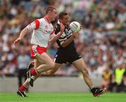 21 July 2002; Eamonn O'Hara of Sligo, is tackled by Colin Holmes of Tyrone during the All-Ireland Senior Football Championship Qualifier Round 4 match between Sligo and Tyrone at Croke Park in Dublin. Photo by Ray McManus/Sportsfile