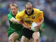 21 July 2002; Eamon Doherty of Donegal is tackled by Graham Geraghty of Meath during the All-Ireland Senior Football Championship Qualifier Round 4 match between Meath and Donegal at Croke Park. Photo by Brian Lawless/Sportsfile