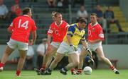 21 July 2002; Philly Ryan of Tipperary, is surrounded by Cork players, from left, Colin Corkery, Brendan Ger O'Sullivan, and Joe Kavanagh during the Bank of Ireland Munster Football Final Replay match between Cork and Tipperary at Páirc Uí Chaoimh in Cork. Photo by Brendan Moran/Sportsfile