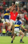 21 July 2002; Maurice McCarthy of Cork in action against Liam England of Tipperary during the Bank of Ireland Munster Football Final Replay match between Cork and Tipperary at Páirc Uí Chaoimh in Cork. Photo by Brendan Moran/Sportsfile