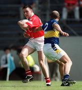 21 July 2002; Joe Kavanagh of Cork in action against Sean Collum of Tipperary during the Bank of Ireland Munster Football Final Replay match between Cork and Tipperary at Páirc Uí Chaoimh in Cork. Photo by Brendan Moran/Sportsfile