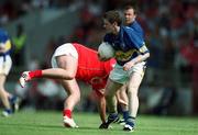 21 July 2002; Willie Morrissey of Tipperary, in action against Colin Corkery of Cork during the Bank of Ireland Munster Football Final Replay match between Cork and Tipperary at Páirc Uí Chaoimh in Cork. Photo by Brendan Moran/Sportsfile