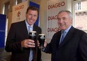 24 July 2002; Taoiseach Bertie Ahern TD with former Irish International Packie Bonner, at the announcement at the Guinness Storehouse, that Diageo is to sponsor the Euro 2008 joint hosting bid by Scotland and Ireland. Photo by David Maher/Sportsfile