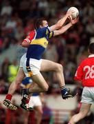 21 July 2002; Eamon Hanrahan of Tipperary in action against Graham Canty of Cork during the Bank of Ireland Munster Football Final Replay match between Cork and Tipperary at Páirc Uí Chaoimh in Cork. Photo by Brendan Moran/Sportsfile