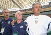 1 June 2002; Republic of Ireland manager Mick McCarthy, left, stands for the national anthem before the start of the game alongside with Mick Byrne, team physio and Ian Evans, assistant manager, right, prior to the FIFA World Cup 2002 Group E match between Republic of Ireland and Cameroon at Big Swan Stadium in Niigata, Japan. Photo by David Maher/Sportsfile