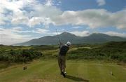 27 July 2002; Christy O'Connor Jnr watches his tee shot from the 4th tee box during day three of the Senior British Open at Royal County Down Golf Club in Newcastle, Down. Photo by Matt Browne/Sportsfile