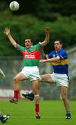 27 July 2002; Trevor Mortimer of Mayo in action against Liam England of Tipperary during the Bank of Ireland All-Ireland Senior Football Championship Qualifier Round 4 match between Mayo and Tipperary at Cusack Park in Ennis, Clare. Photo by Damien Eagers/Sportsfile
