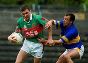 27 July 2002; James Horan of Mayo in action against Damian Byrne of Tipperary during the Bank of Ireland All-Ireland Senior Football Championship Qualifier Round 4 match between Mayo and Tipperary at Cusack Park in Ennis, Clare. Photo by Damien Eagers/Sportsfile