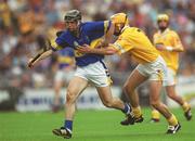 28 July 2002; Eoin Kelly of Tipperary is tackled by Ciarán Herron of Antrim during the All-Ireland Senior Hurling Championship Quarter-Final match between Antrim and Tipperary at Croke Park in Dublin. Photo by Ray McManus/Sportsfile