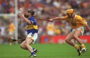 28 July 2002; Eoin Kelly of Tipperary in action against Ciarán Herron of Antrim during the All-Ireland Senior Hurling Championship Quarter-Final match between Antrim and Tipperary at Croke Park in Dublin. Photo by Ray McManus/Sportsfile