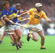 28 July 2002; Colm McGuckian of Antrim in action against Noel Morris of Tipperary during the All-Ireland Senior Hurling Championship Quarter-Final match between Antrim and Tipperary at Croke Park in Dublin. Photo by Aoife Rice/Sportsfile