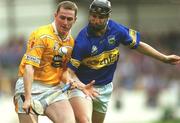 28 July 2002; Paddy Richmond of Antrim in action against Philip Maher of Tipperary during the All-Ireland Senior Hurling Championship Quarter-Final match between Antrim and Tipperary at Croke Park in Dublin. Photo by Aoife Rice/Sportsfile