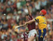 28 July 2002; Eugene Cloonan of Galway in action against Brian Lohan of Clare during the Guinness All-Ireland Senior Hurling Championship Quarter-Final match between Clare and Galway at Croke Park. Photo by Ray McManus/Sportsfile