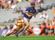 28 July 2002; Thomas Dunne of Tipperary in action against Kieran Kelly of Antrim during the All-Ireland Senior Hurling Championship Quarter-Final match between Antrim and Tipperary at Croke Park in Dublin. Photo by Aoife Rice/Sportsfile