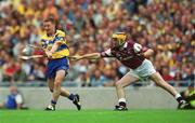 28 July 2002; James O'Connor of Clare gets his shot off despite the efforts of Ger Farragher of Galway during the Guinness All-Ireland Senior Hurling Championship Quarter-Final match between Clare and Galway at Croke Park. Photo by Ray McManus/Sportsfile