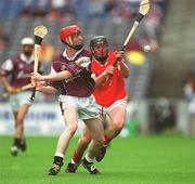 28 July 2002; Paul Flynn of Galway in action against Maurice O'Sullivan of Cork during the All-Ireland Minor Hurling Championship Quarter-Final match between Cork and Galway at Croke Park in Dublin. Photo by Brian Lawless/Sportsfile