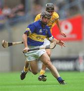 28 July 2002; Eoin Kelly of Tipperary in action against Johnny Campbell of Antrim during the All-Ireland Senior Hurling Championship Quarter-Final match between Antrim and Tipperary at Croke Park in Dublin. Photo by Aoife Rice/Sportsfile