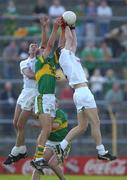 27 July 2002; Ronan Sweeney of Kildare fields a high ball ahead of team-mate Dermot Earley and Donal Daly of Kerry during the Bank of Ireland All-Ireland Football Championship Qualifier match between Kerry and Kildare at Semple Stadium in Thurles, Tipperary. Photo by Brendan Moran/Sportsfile