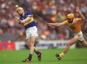 28 July 2002; Lar Corbett of Tipperary in action against Karl McKeegan of Antrim during the All-Ireland Senior Hurling Championship Quarter-Final match between Antrim and Tipperary at Croke Park in Dublin. Photo by Ray McManus/Sportsfile
