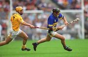 28 July 2002; Mark O'Leary of Tipperary races clear of Ciarán Herron of Antrim during the All-Ireland Senior Hurling Championship Quarter-Final match between Antrim and Tipperary at Croke Park in Dublin. Photo by Ray McManus/Sportsfile