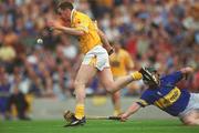 28 July 2002; Paddy Richmond of Antrim in action against David Kennedy of Tipperary during the All-Ireland Senior Hurling Championship Quarter-Final match between Antrim and Tipperary at Croke Park in Dublin. Photo by Ray McManus/Sportsfile