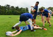 19 July 2017; Leinster academy player Ronan Kelleher coaches young players, from left, Jack Hennesy, Nicola Giralei and Elliot Sellers during the Bank of Ireland Leinster Rugby School of Excellence at Kings Hospital in Palmerstown, Dublin. Photo by Sam Barnes/Sportsfile