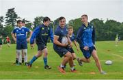 19 July 2017; Leinster academy players Ronan Kelleher, centre, and Conor Dean, right, participate in a drill with attendees during the Bank of Ireland Leinster Rugby School of Excellence at Kings Hospital in Palmerstown, Dublin. Photo by Sam Barnes/Sportsfile