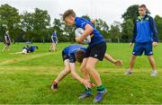 19 July 2017; Leinster academy player Conor Dean, right, coaches young players PJ Tiernan, left, and Sam Hamilton, during the Bank of Ireland Leinster Rugby School of Excellence at Kings Hospital in Palmerstown, Dublin.  Photo by Sam Barnes/Sportsfile