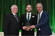 21 July 2017; Declan Carey of Cork City is presented with the Best Digital Initiative award by FAI President Tony Fitzgerald, left, and FAI Chief Executive John Delaney, right, at the FAI Communications Awards & Delegates Dinner at Hotel Kilkenny in Kilkenny. Photo by Seb Daly/Sportsfile