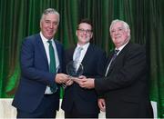 21 July 2017; Sportsfile photographer Ramsey Cardy is presented with the Best Photograph award by FAI Chief Executive John Delaney, left, and FAI President Tony Fitzgerald at the FAI Communications Awards & Delegates Dinner at Hotel Kilkenny in Kilkenny. Photo by Seb Daly/Sportsfile