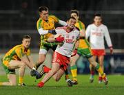 21 March 2012; Brian McGarvey, Tyrone, in action against Thomas McKinley, Donegal. Cadburys Ulster Under 21 Football Championship Quarter-Final,Tyrone v Donegal, Tyrone v Donegal, Healy Park, Omagh, Co. Tyrone. Picture credit: Oliver McVeigh / SPORTSFILE