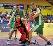22 March 2012; Darren McGrath, left, and Greg Prochal, right, Colaiste Chriost Ri, in action against Terry Guo, Abbey Grammar. U19C Boys - All-Ireland Schools League Finals 2012, Abbey Grammar, Newry v Colaiste Chriost Ri, Cork, National Basketball Arena, Tallaght, Dublin. Picture credit: Barry Cregg / SPORTSFILE