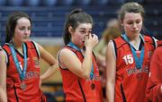 22 March 2012; A dejected Antonia Cummins, centre, Mercy Coolock, wipes away her tears alongside team-mates Lynn Ryan, left, and Sarah Fitzpatrick after the game. U16B Girls - All-Ireland Schools League Finals 2012, Mercy Coolock, Dublin v Christ the King, Cork, National Basketball Arena, Tallaght, Dublin. Picture credit: Barry Cregg / SPORTSFILE