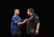22 March 2011; Kevin Painter and Adrian Lewis following their match during the McCoy's Premier League Darts Tournament. O2, Dublin. Picture credit: Paul Murphy / SPORTSFILE