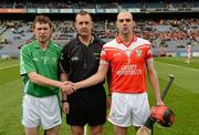17 March 2012; The captains, Brendan O'Meara, left, Coolderry, and Johnny Campbell, Loughgiel Shamrocks, shake hands accross referee Alan Kelly before the game. AIB GAA Hurling All-Ireland Senior Club Championship Final, Coolderry, Offaly, v Loughgiel Shamrocks, Antrim, Croke Park, Dublin. Picture credit: Ray McManus / SPORTSFILE