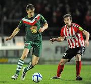23 March 2012; Davin O'Neill, Cork City, in action against Ryan McBride, Derry City. Airtricity League Premier Division, Derry City v Cork City, Brandywell, Derry. Picture credit: Oliver McVeigh / SPORTSFILE