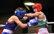 23 March 2012; Dervla Duffy, right, Ireland, exchanges punches with Kristen Frazser, Holland, during their 57kg bout. Women's Boxing International, Ireland v Holland, National Stadium, Dublin. Picture credit: Barry Cregg / SPORTSFILE