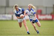 22 July 2017; Donna English of Cavan in action against Laura Nerney of Laois during the TG4 Senior All Ireland Championship Preliminary match between Cavan and Laois in Ashbourne, Co. Meath. Photo by Barry Cregg/Sportsfile